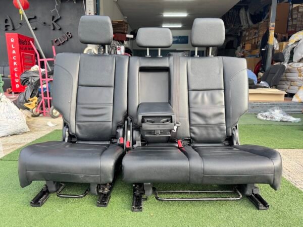 Genuine leather car seat set removed from Ford Everest 2020 (take-off condition). This complete second and third-row seat assembly includes integrated headrests, seat belts, center armrest with cup holders, and original rails for direct fitting