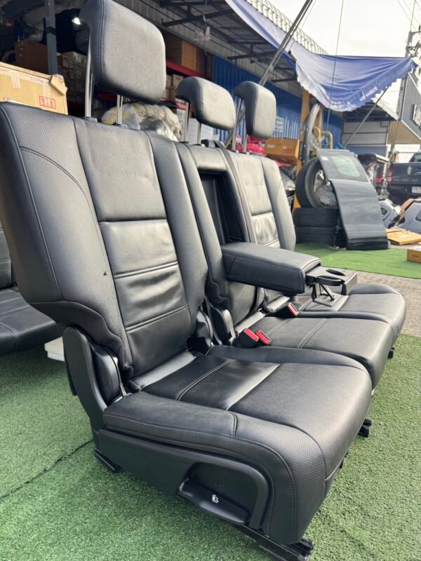 Genuine leather car seat set removed from Ford Everest 2020 (take-off condition). This complete second and third-row seat assembly includes integrated headrests, seat belts, center armrest with cup holders, and original rails for direct fitting - Image 3