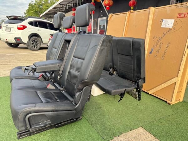 Genuine leather car seat set removed from Ford Everest 2020 (take-off condition). This complete second and third-row seat assembly includes integrated headrests, seat belts, center armrest with cup holders, and original rails for direct fitting - Image 6
