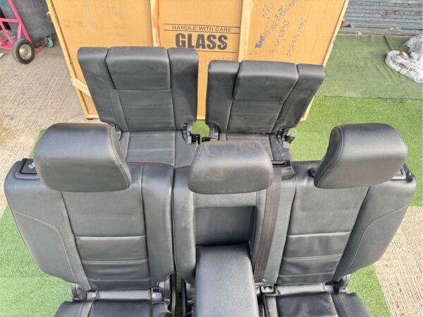 Genuine leather car seat set removed from Ford Everest 2020 (take-off condition). This complete second and third-row seat assembly includes integrated headrests, seat belts, center armrest with cup holders, and original rails for direct fitting - Image 7